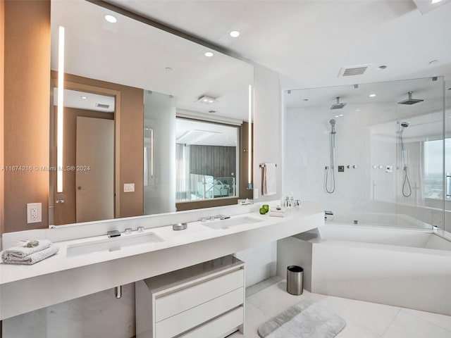 bathroom with vanity and separate shower and tub