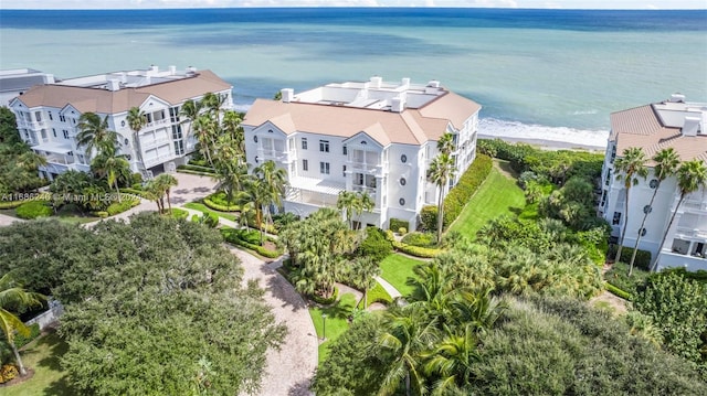 bird's eye view with a water view and a beach view