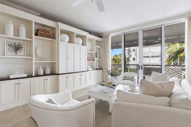 tiled living room featuring ceiling fan and plenty of natural light