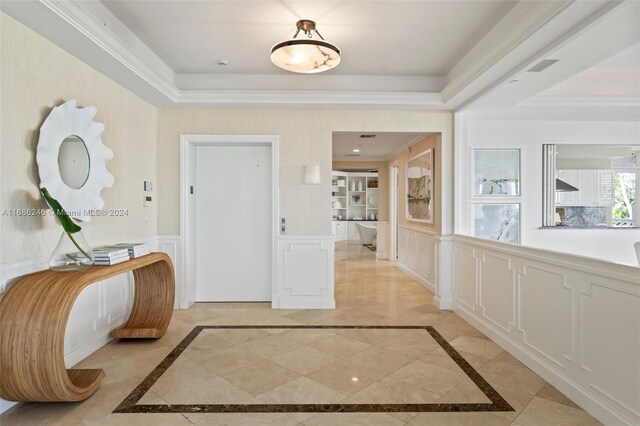 hallway featuring crown molding