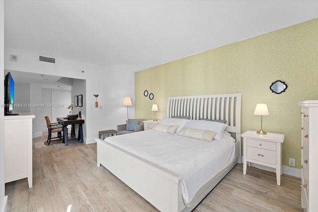 bedroom with light wood-type flooring