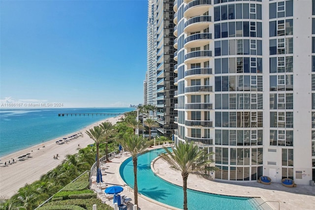 exterior space featuring a view of the beach and a water view