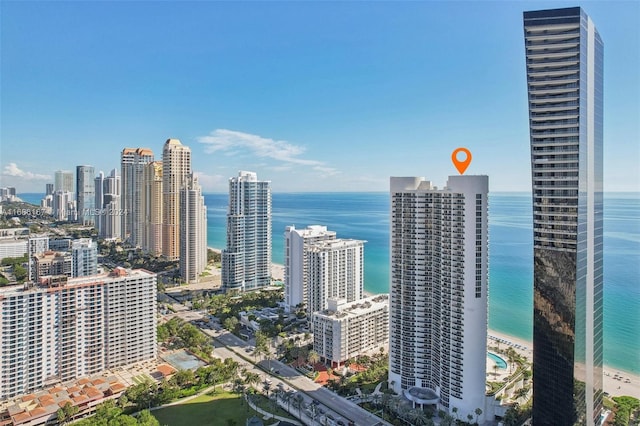 city view featuring a water view and a view of the beach