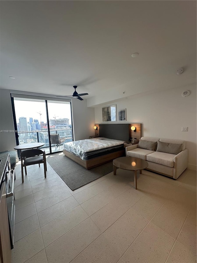 bedroom featuring access to exterior and ceiling fan