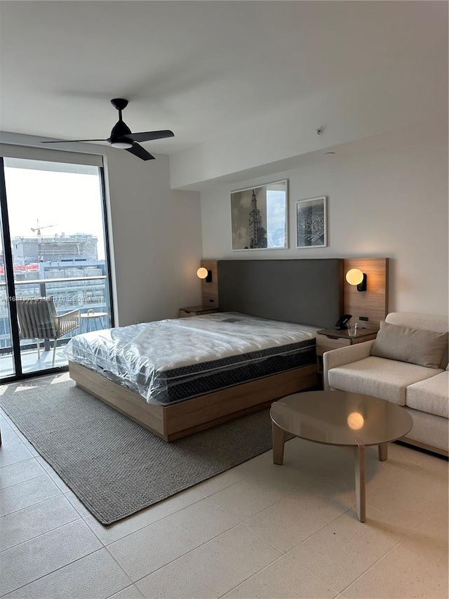 bedroom featuring ceiling fan and access to exterior