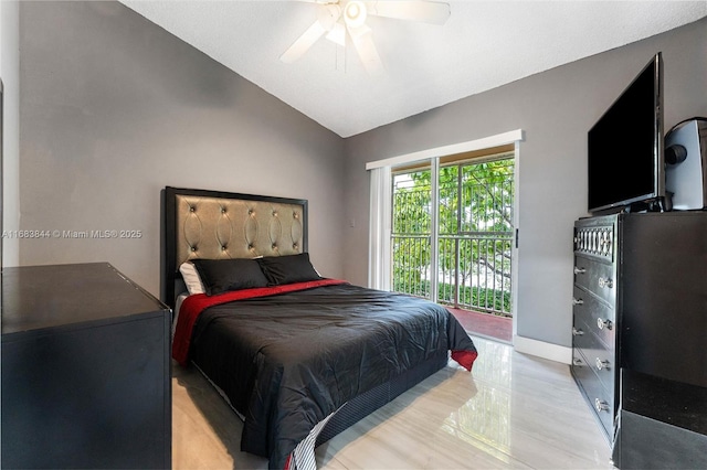 2650 NW 28th St Unit 908-9, Miami, FL 33142 - bedroom with ceiling fan, baseboards, access to exterior, and vaulted ceiling