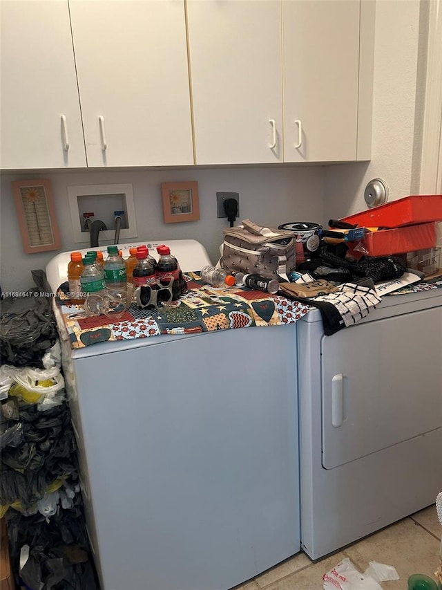 laundry area featuring cabinets and washer / clothes dryer