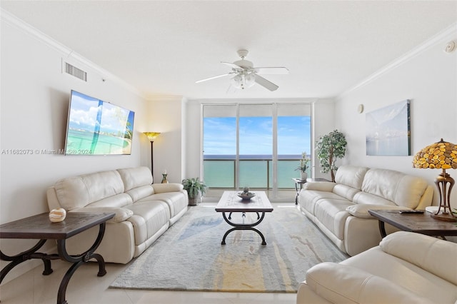 living room with crown molding, light tile patterned flooring, a water view, and ceiling fan