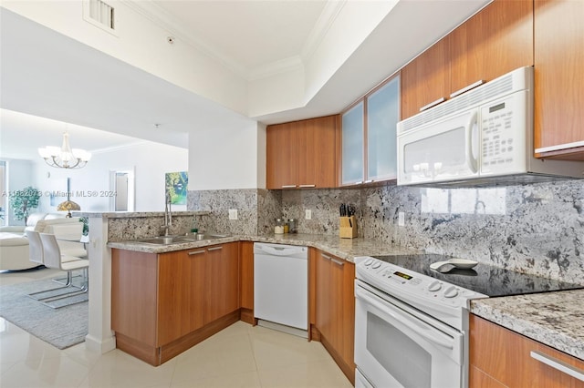 kitchen with backsplash, sink, light tile patterned floors, a chandelier, and white appliances