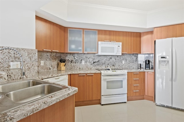 kitchen featuring decorative backsplash, ornamental molding, sink, light tile patterned floors, and white appliances