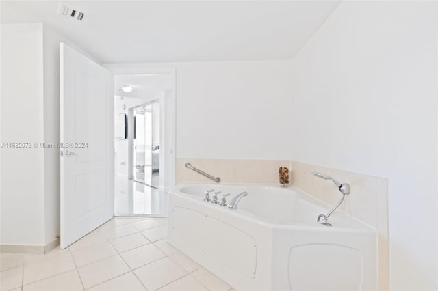 bathroom featuring a bath and tile patterned floors