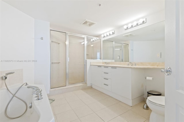 16699 Collins Ave Unit 2202, Sunny Isles Beach, FL 33160 - bathroom with double vanity, a stall shower, a bath, tile patterned floors, and toilet