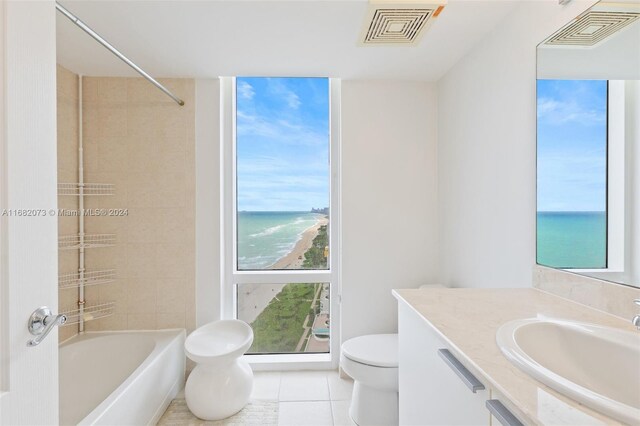 16699 Collins Ave Unit 2202, Sunny Isles Beach, FL 33160 - full bath with toilet, vanity, tile patterned flooring, a water view, and washtub / shower combination