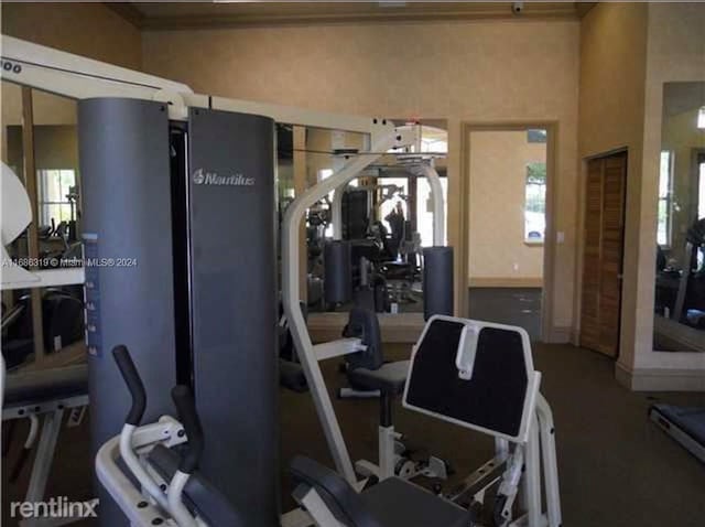 workout area with ornamental molding