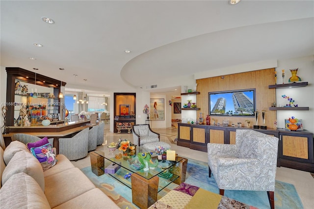 living room featuring a notable chandelier