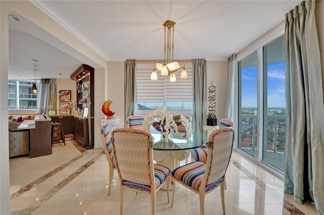 dining area featuring a wealth of natural light, ornamental molding, and a notable chandelier