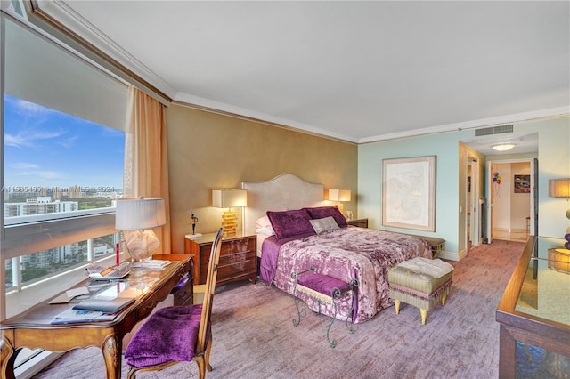 carpeted bedroom featuring crown molding