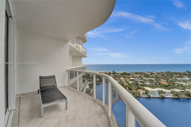 balcony featuring a water view