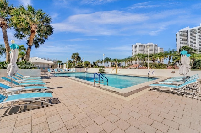 view of swimming pool featuring a patio area