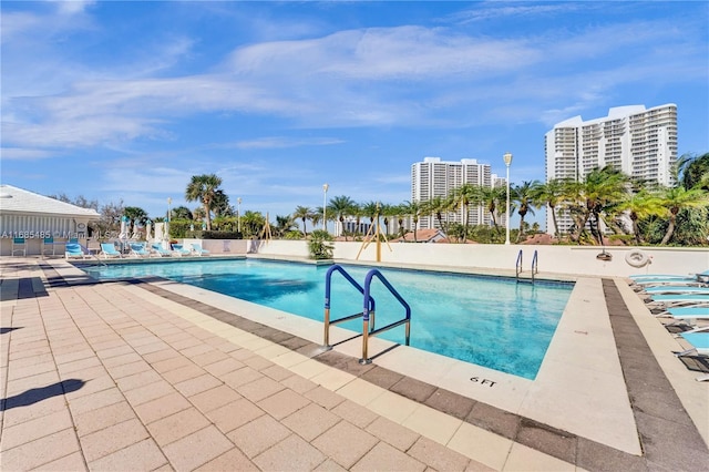 view of swimming pool with a patio area