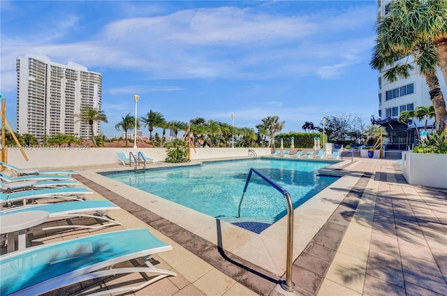 view of swimming pool with a patio area