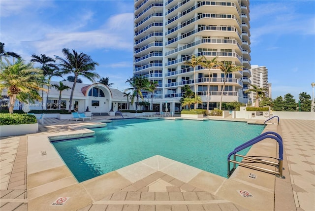 view of swimming pool with a patio