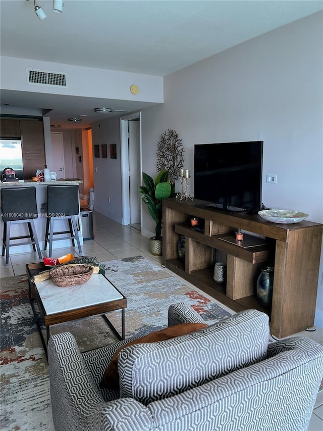 living room featuring light tile patterned floors