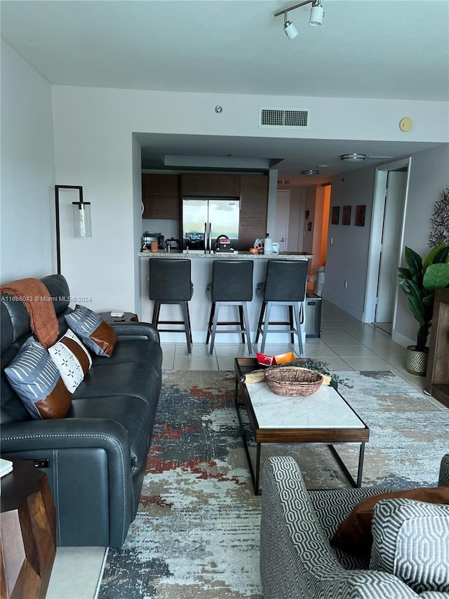 living room featuring tile patterned flooring