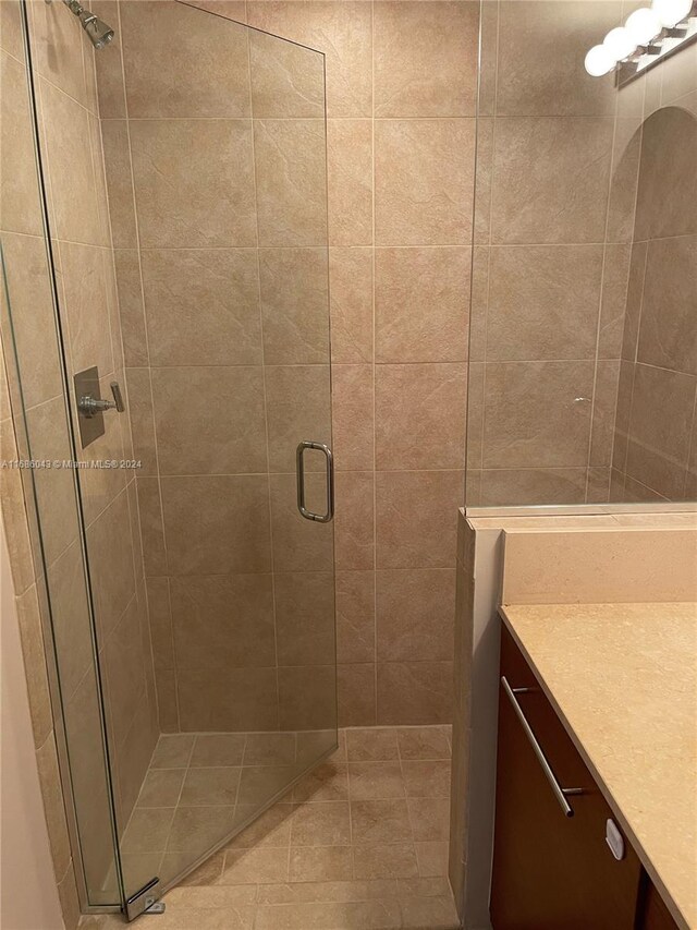 bathroom with vanity and walk in shower