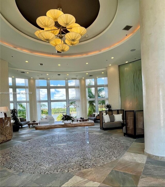 2641 N Flamingo Rd Unit 802N, Sunrise, FL 33323 - community lobby with recessed lighting, a towering ceiling, and a water view