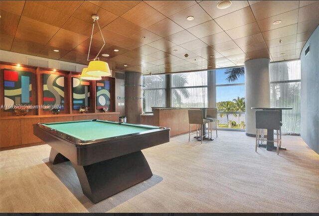 recreation room featuring light carpet, a wealth of natural light, pool table, and floor to ceiling windows