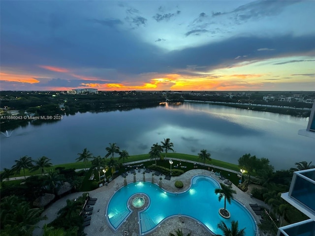 aerial view at dusk with a water view