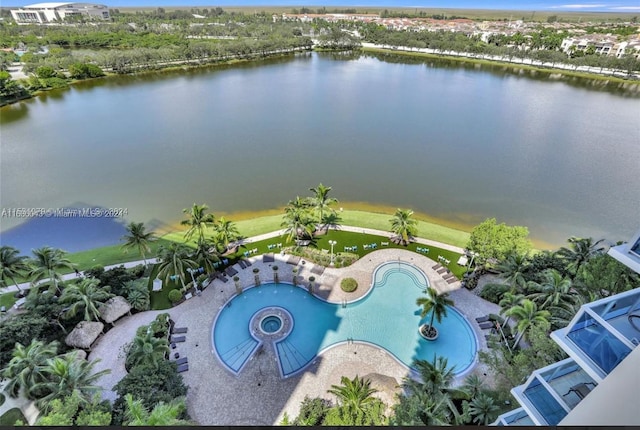 birds eye view of property with a water view