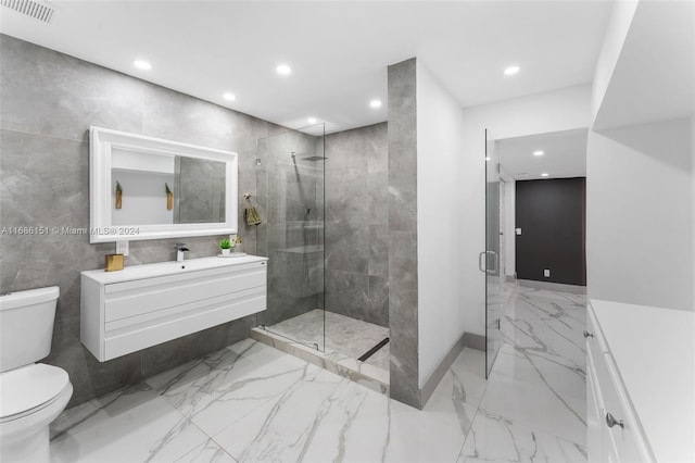 bathroom featuring vanity, toilet, and walk in shower