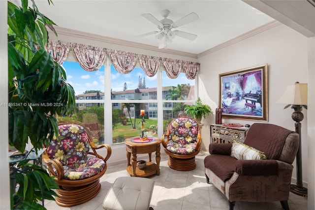 living area featuring ornamental molding, light tile patterned flooring, and ceiling fan