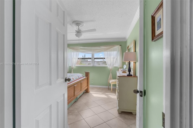 bathroom featuring tile patterned floors, crown molding, a textured ceiling, and ceiling fan