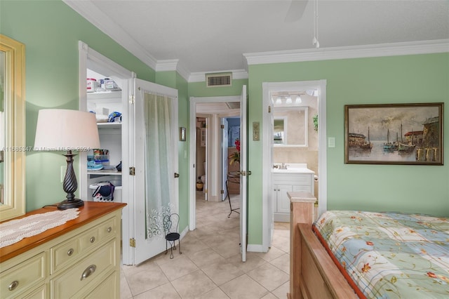 bedroom with ensuite bathroom, sink, ceiling fan, crown molding, and light tile patterned floors