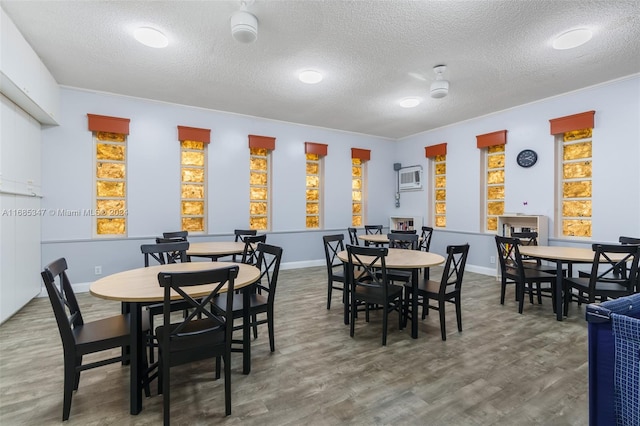 dining space with ornamental molding and a textured ceiling