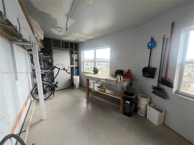 basement with radiator and a workshop area