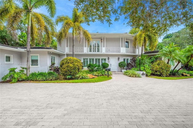 view of front of property with a balcony