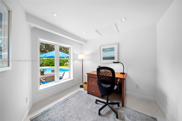 home office featuring light tile patterned flooring