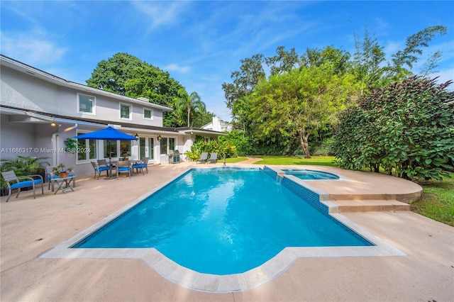 view of pool featuring an in ground hot tub and a patio area