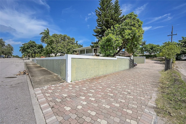 830 S Ridge St, Lake Worth, FL 33460 - view of property exterior featuring a fenced front yard and a gate