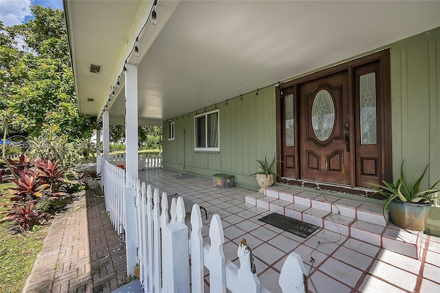 830 S Ridge St, Lake Worth, FL 33460 - view of exterior entry featuring a porch