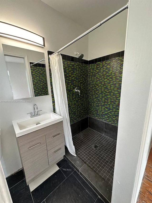 bathroom with vanity, hardwood / wood-style flooring, and a shower with shower curtain