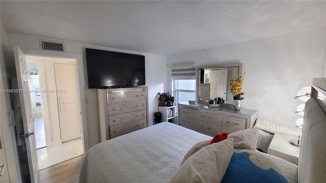 bedroom featuring light wood-type flooring