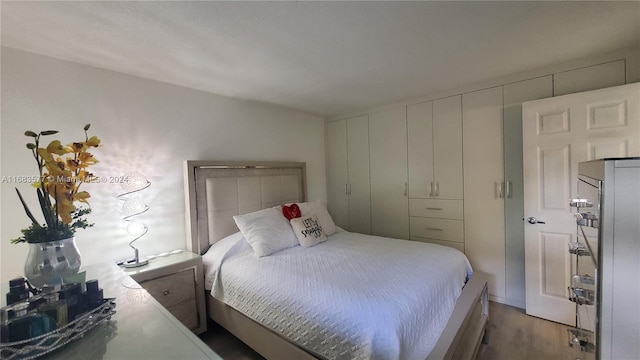 bedroom featuring hardwood / wood-style flooring and a closet