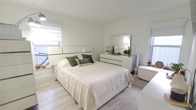 bedroom with light hardwood / wood-style floors