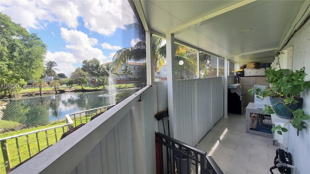 balcony featuring a water view