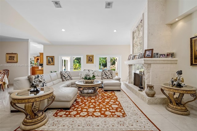 living room with recessed lighting, visible vents, tile patterned flooring, and a high end fireplace